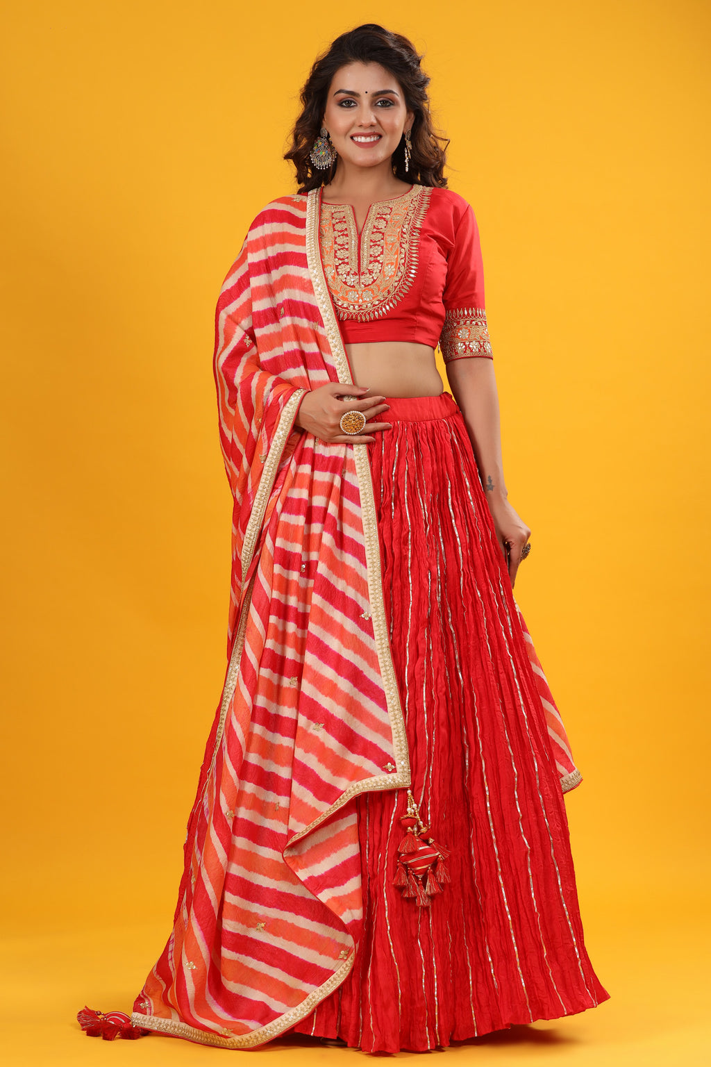 Shop a Red gota patti embroidered set featuring silk dupatta set. It comes with a beautiful striped multicolor embroidered dupatta. Pair it with beautiful jewelry to enhance your look. Shop online from Pure Elegance.