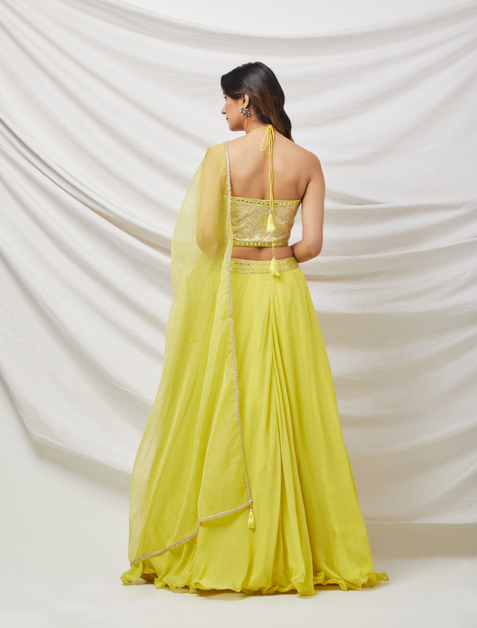 Shop a green lime gotta patti and mirror work lehenga with embroidered blouse & dupatta. Dazzle on weddings and special occasions with exquisite Indian designer dresses, sharara suits, Anarkali suits, bridal lehengas, and sharara suits from Pure Elegance Indian clothing store in the USA. Shop online from Pure Elegance.