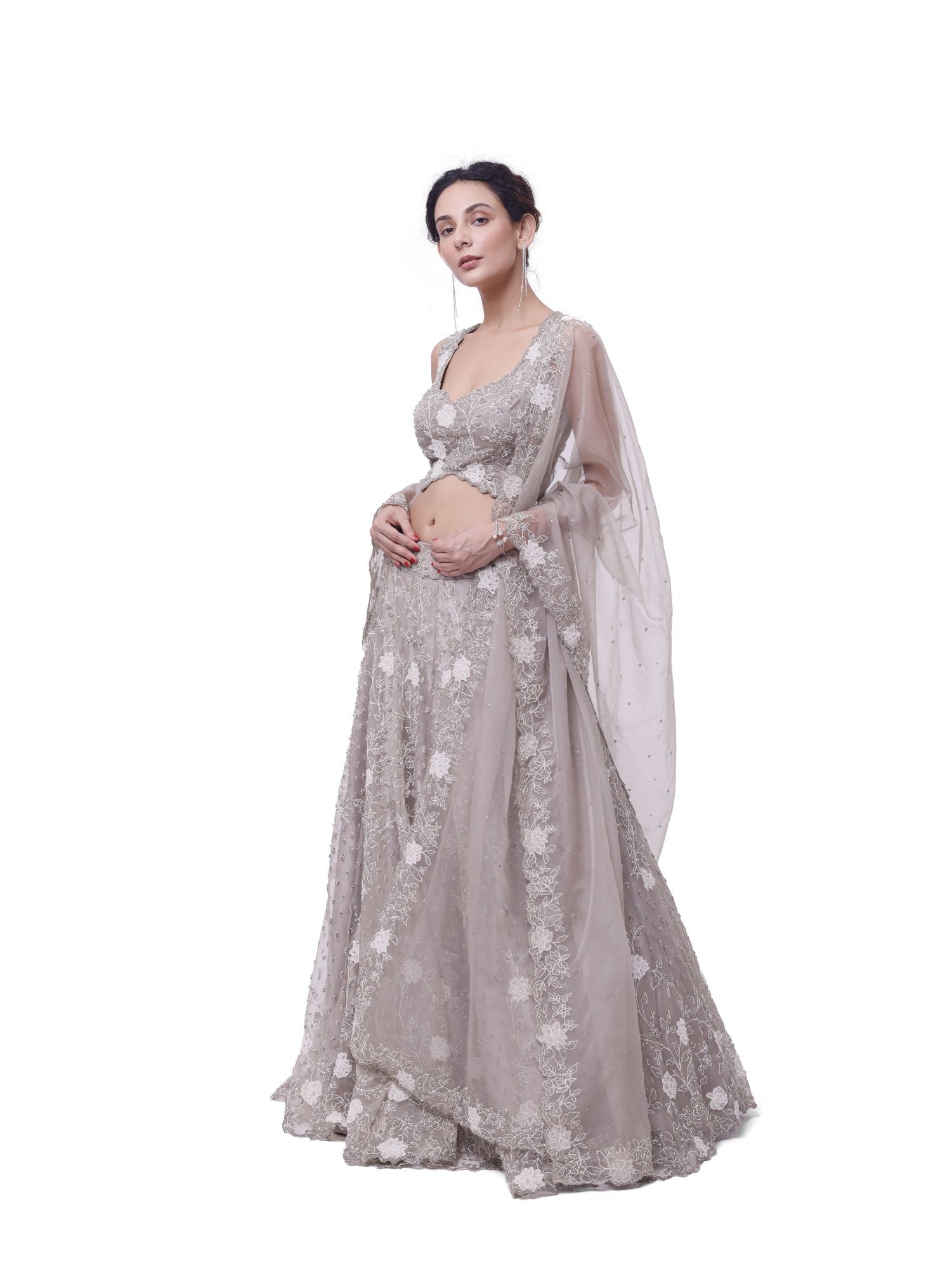 Shop beige embroidered organza lehenga online in USA with dupatta. Dazzle on weddings and special occasions with exquisite designer lehengas, Anarkali suit, sharara suit, Indowestern outfits, bridal lehengas from Pure Elegance Indian clothing store in the USA. -side