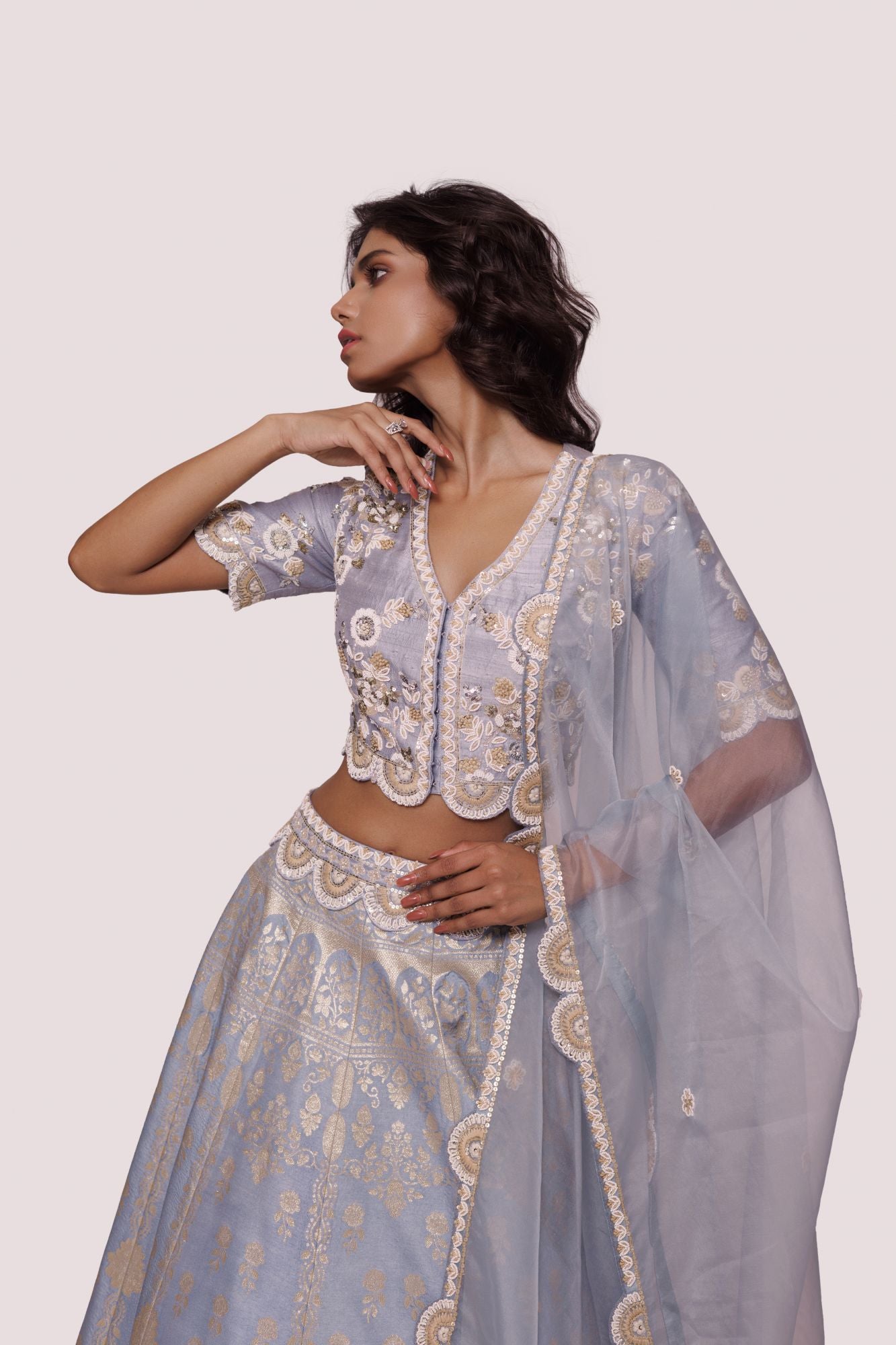 Buy powder blue hand embroidered silk lehenga online in USA with dupatta. Dazzle on weddings and special occasions with exquisite designer lehengas, Anarkali suit, sharara suit, Indowestern outfits, bridal lehengas from Pure Elegance Indian clothing store in the USA. -closeup