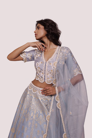 Buy powder blue hand embroidered silk lehenga online in USA with dupatta. Dazzle on weddings and special occasions with exquisite designer lehengas, Anarkali suit, sharara suit, Indowestern outfits, bridal lehengas from Pure Elegance Indian clothing store in the USA. -closeup