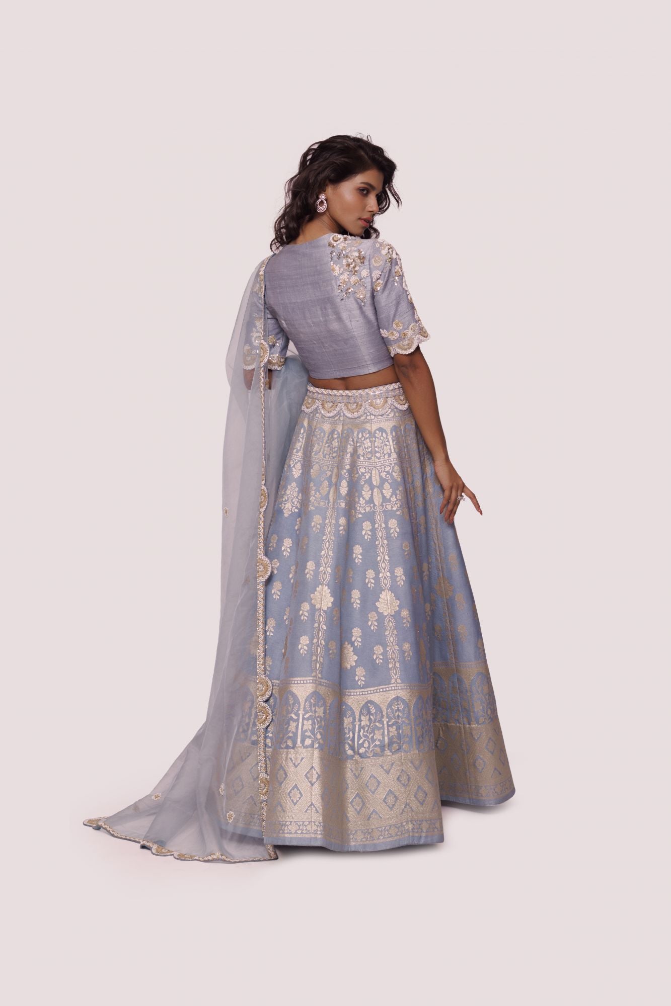 Buy powder blue hand embroidered silk lehenga online in USA with dupatta. Dazzle on weddings and special occasions with exquisite designer lehengas, Anarkali suit, sharara suit, Indowestern outfits, bridal lehengas from Pure Elegance Indian clothing store in the USA. -back