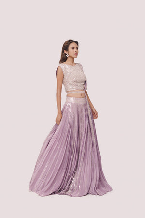 Shop beautiful lavender embroidered crepe lehenga online in USA with belt. Dazzle on weddings and special occasions with exquisite designer lehengas, Anarkali suit, sharara suit, Indowestern outfits, bridal lehengas from Pure Elegance Indian clothing store in the USA. -side
