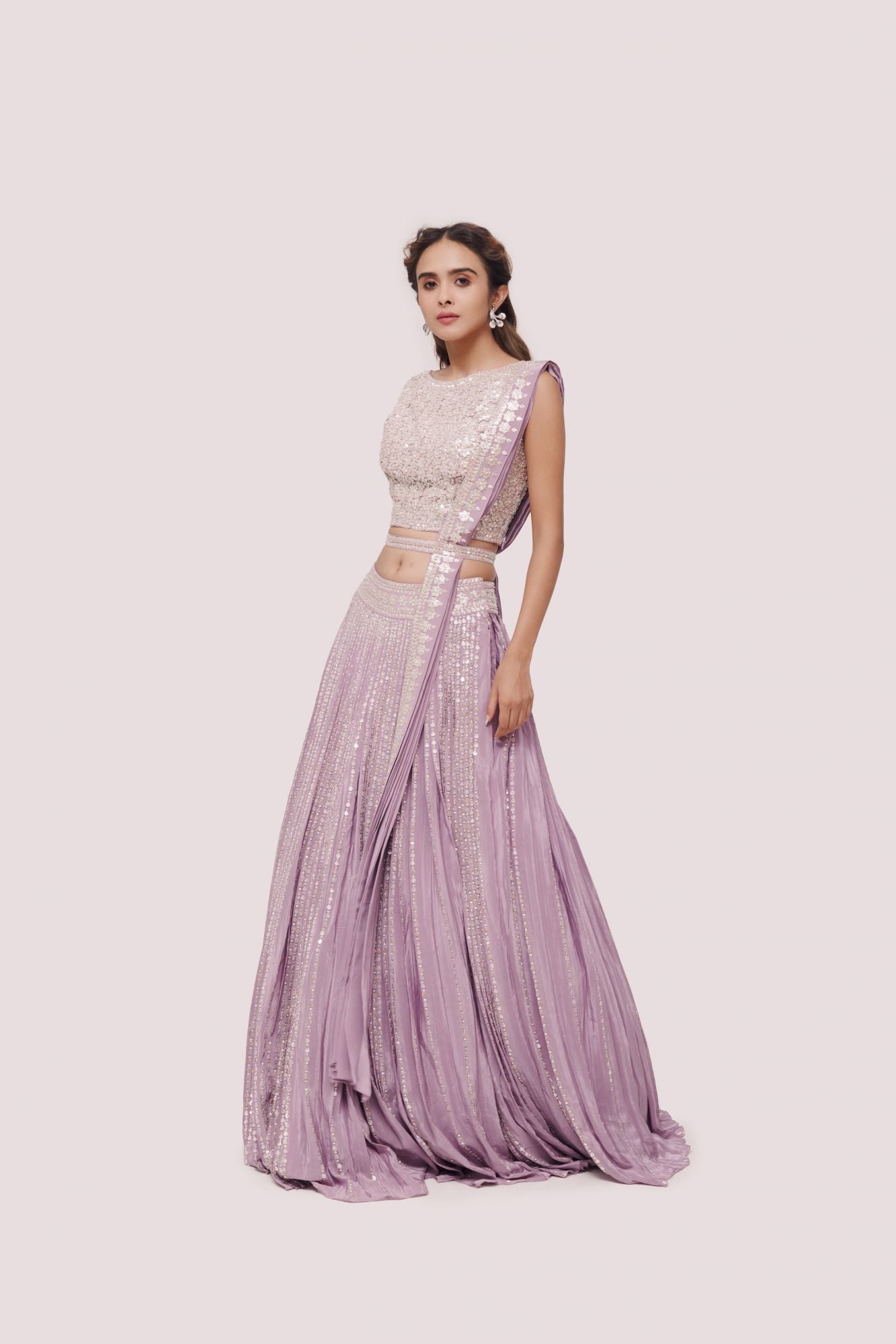 Shop beautiful lavender embroidered crepe lehenga online in USA with belt. Dazzle on weddings and special occasions with exquisite designer lehengas, Anarkali suit, sharara suit, Indowestern outfits, bridal lehengas from Pure Elegance Indian clothing store in the USA. -lehenga