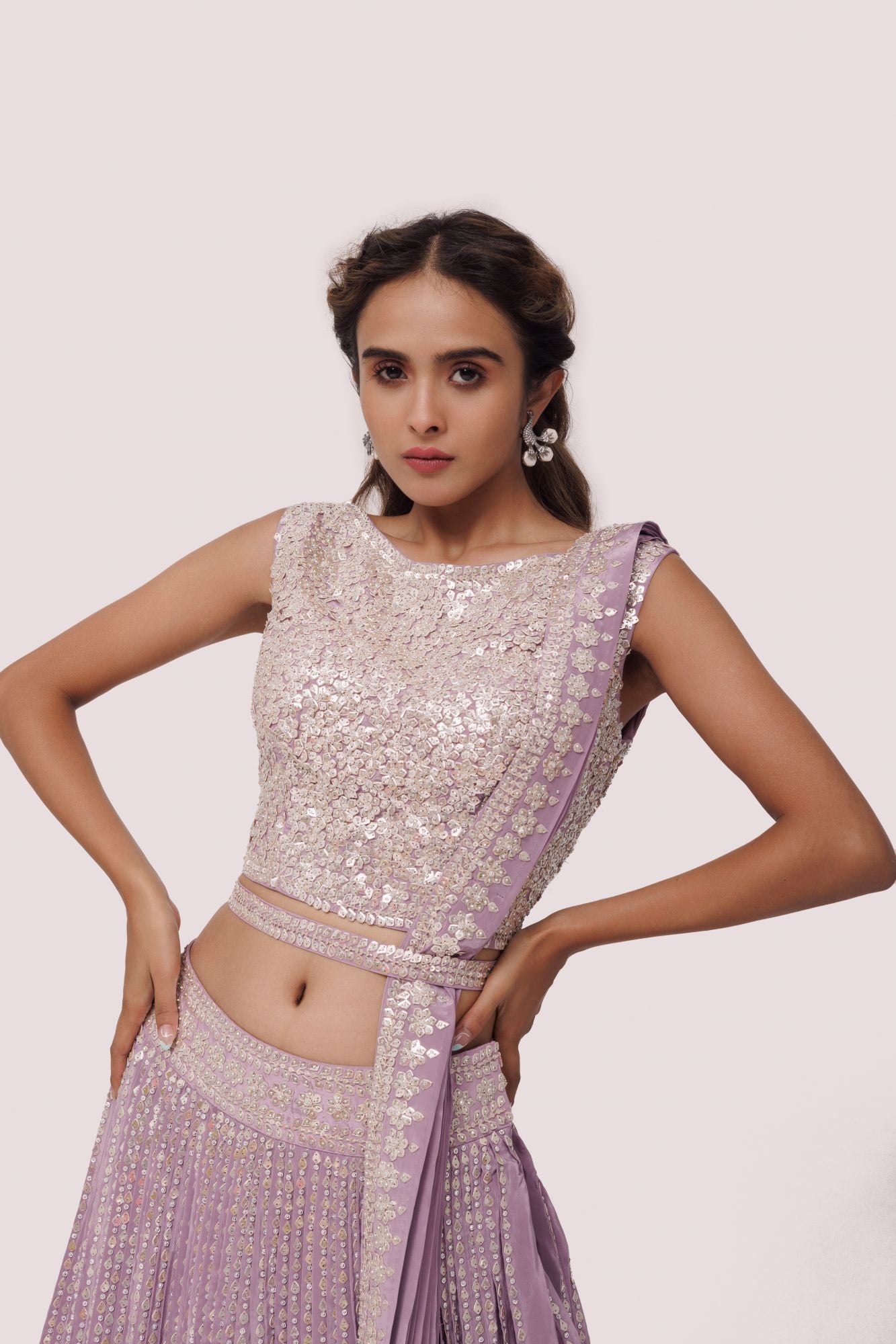 Shop beautiful lavender embroidered crepe lehenga online in USA with belt. Dazzle on weddings and special occasions with exquisite designer lehengas, Anarkali suit, sharara suit, Indowestern outfits, bridal lehengas from Pure Elegance Indian clothing store in the USA. -closeup