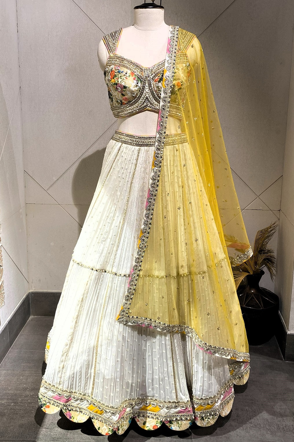 Shop beautiful cream embroidered designer saree online in USA with yellow dupatta. Dazzle at parties and special occasions in beautiful designer sarees, party sarees, Bollywood sarees, embroidered sarees, handwoven sarees from Pure Elegance Indian saree store in USA.-full view