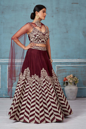 Buy maroon embroidered silk designer lehenga online in USA with dupatta. Look royal on special occasions in exquisite designer lehengas, pure silk sarees, handloom sarees, Bollywood sarees, Anarkali suits, Banarasi sarees, organza sarees from Pure Elegance Indian saree store in USA.-lehenga