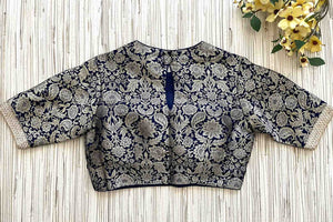 Buy navy blue Banarasi saree blouse online in USA with lace. Elevate your saree style with exquisite readymade sari blouses, embroidered saree blouses, Banarasi sari blouse, designer saree blouse, choli-cut blouses, corset blouses from Pure Elegance Indian fashion store in USA.-back