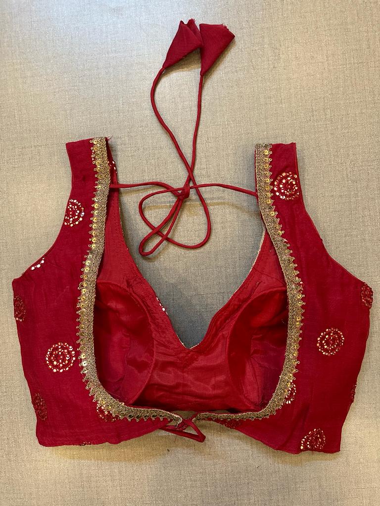Shop stunning red embroidered sleeveless saree blouse online in USA. Elevate your saree style with exquisite readymade sari blouses, embroidered saree blouses, Banarasi sari blouse, designer saree blouse, choli-cut blouses, corset blouses from Pure Elegance Indian fashion store in USA.-back