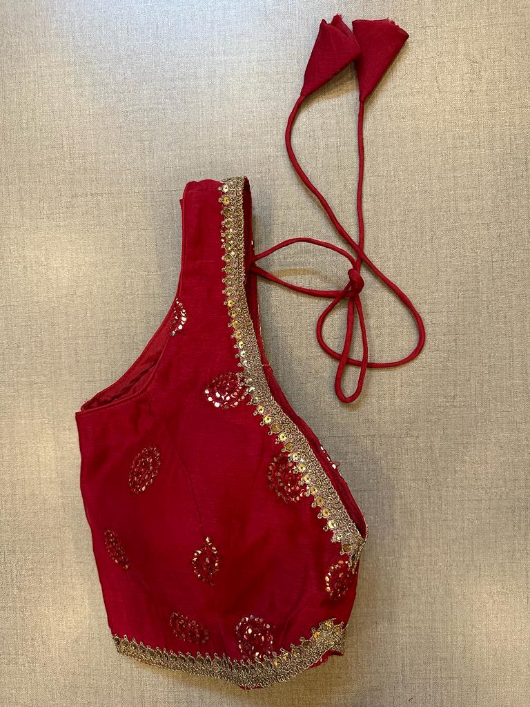 Shop stunning red embroidered sleeveless saree blouse online in USA. Elevate your saree style with exquisite readymade sari blouses, embroidered saree blouses, Banarasi sari blouse, designer saree blouse, choli-cut blouses, corset blouses from Pure Elegance Indian fashion store in USA.-side
