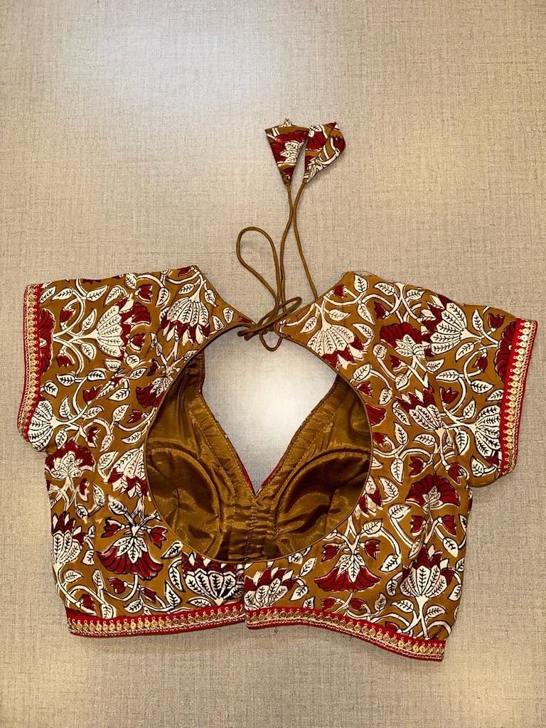 Shop brown printed saree blouse online in USA with sequin lace. Elevate your saree style with exquisite readymade sari blouses, embroidered saree blouses, Banarasi sari blouse, designer saree blouse, choli-cut blouses, corset blouses from Pure Elegance Indian fashion store in USA.-back