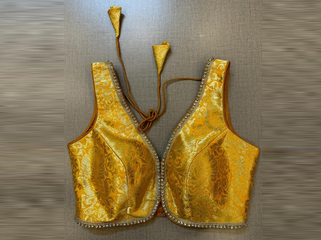 Buy yellow Banarasi sleeveless sari blouse online in USA with stone lace. Elevate your saree style with exquisite readymade sari blouses, embroidered saree blouses, Banarasi sari blouse, designer saree blouse, choli-cut blouses, corset blouses from Pure Elegance Indian fashion store in USA.-full view