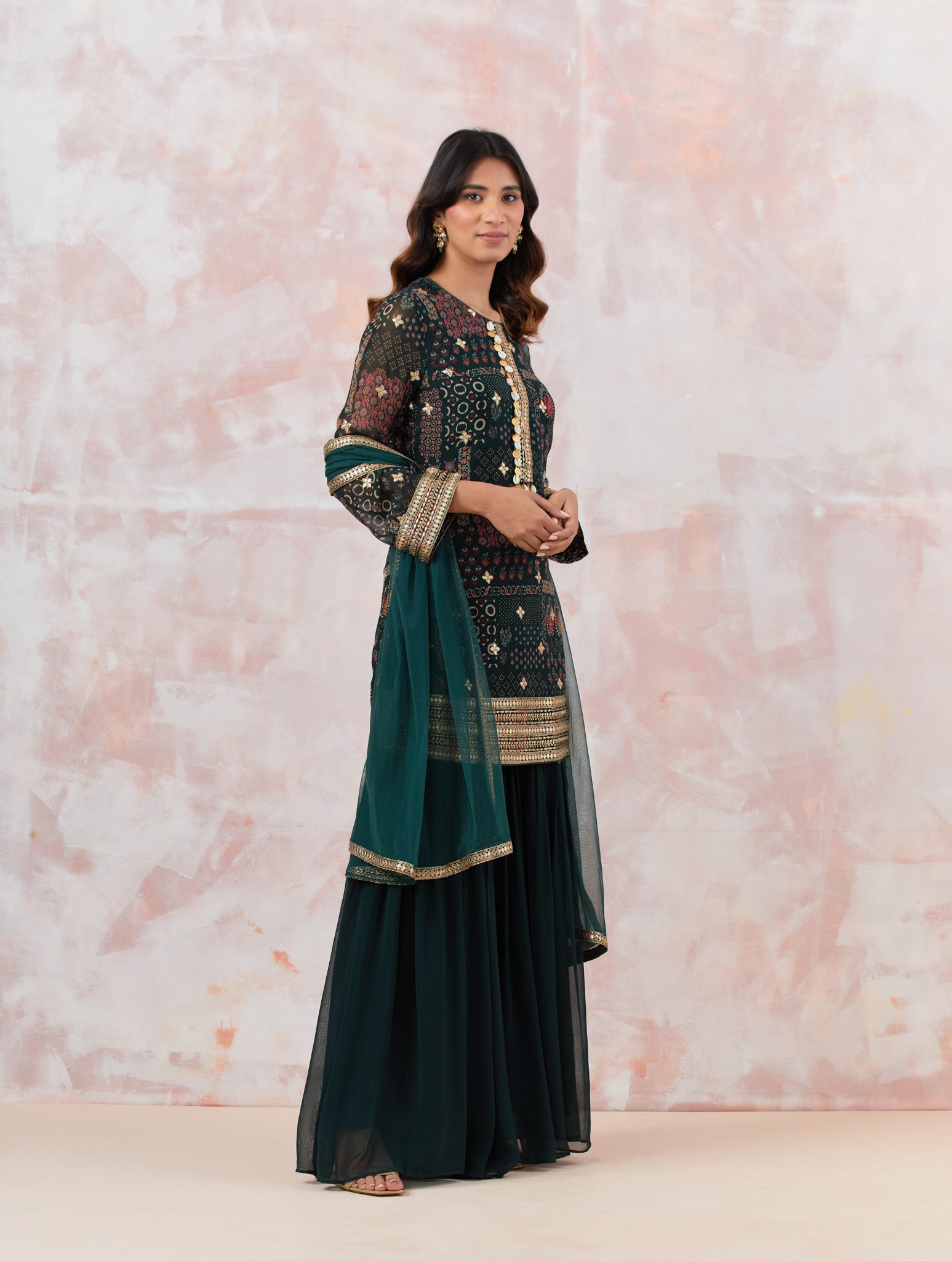 Bottle Green Stylish Embroidered Sharara Suit SetBuy Bottle green sharara set featuring Kurta with foil work, shells, and coin detailing, also plain sharara  It is best for occasions & parties. Dazzle on weddings and special occasions with exquisite Indian designer dresses, sharara suits, Anarkali suits, and wedding lehengas from Pure Elegance Indian fashion store in the USA.