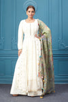 Shop an off-white naira cut suit set with mirror work and embroidered kurta, plazo, and floral embroidered dupatta. Dazzle on special occasions with exquisite Indian designer dresses, sharara suits, Anarkali suits, bridal lehengas, and sharara suits from Pure Elegance Indian clothing store in the USA. Shop online from Pure Elegance.
