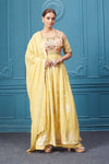 Shop a yellow naira cut suit set with mirror work and embroidered kurta, plazzo, 3/4th sleeves, and beautiful mirror work embroidered dupatta. Dazzle on special occasions with exquisite Indian designer dresses, sharara suits, Anarkali suits, bridal lehengas, and sharara suits from Pure Elegance Indian clothing store in the USA. Shop online from Pure Elegance.