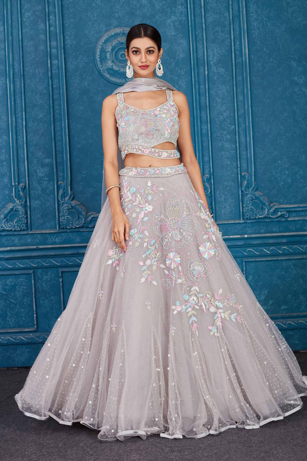 Shop light grey embroidered net lehenga online in USA with dupatta. Slay in style at wedding festivities in this beautiful designer lehengas. hand embroidered lehengas, Bollywood lehenga, Anarkali suits, sharara suits from Pure Elegance Indian saree store in USA. -full view