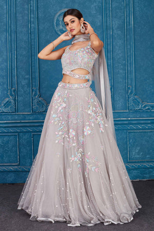 Shop light grey embroidered net lehenga online in USA with dupatta. Slay in style at wedding festivities in this beautiful designer lehengas. hand embroidered lehengas, Bollywood lehenga, Anarkali suits, sharara suits from Pure Elegance Indian saree store in USA. -lehenga