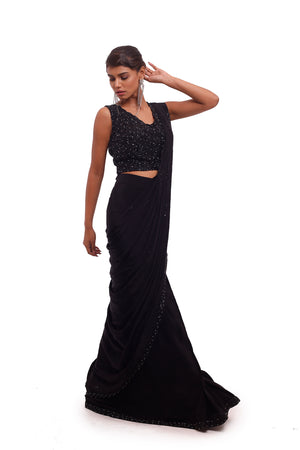 Buy beautiful black crepe draped saree online in USA with sequin blouse. Look your best at parties and weddings in beautiful designer sarees, embroidered sarees, handwoven sarees, silk sarees, organza saris from Pure Elegance Indian saree store in USA.-side