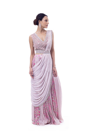 Shop light pink pre-draped chiffon saree online in USA with embellished blouse. Look your best at parties and weddings in beautiful designer sarees, embroidered sarees, handwoven sarees, silk sarees, organza saris from Pure Elegance Indian saree store in USA.-front