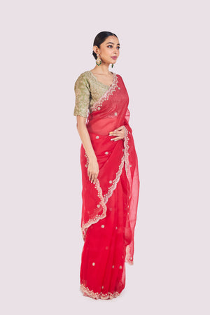 Buy red embroidered organza saree online in USA with green raw silk blouse. Look your best at parties and weddings in beautiful designer sarees, embroidered sarees, handwoven sarees, silk sarees, organza saris from Pure Elegance Indian saree store in USA.-side