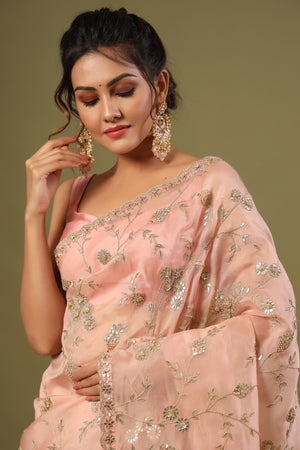Shop elegant dusty pink embroidered organza saree online in USA. Make a fashion statement at weddings with stunning designer sarees, embroidered sarees with blouse, wedding sarees, handloom sarees from Pure Elegance Indian fashion store in USA.-closeup