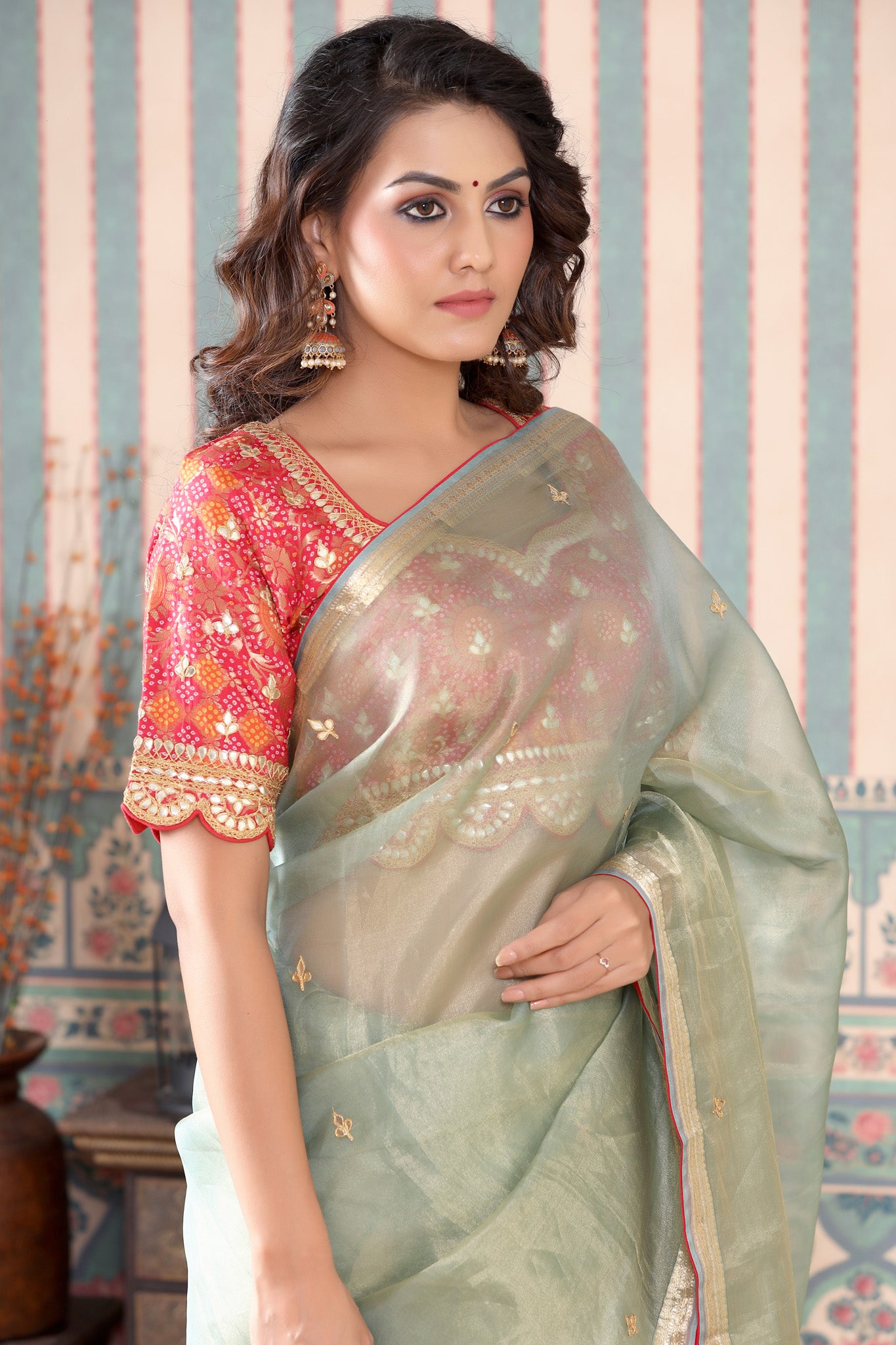 Shop stunning golden green tissue silk saree online in USA with pink embroidered blouse. Make a fashion statement at weddings with stunning designer sarees, embroidered sarees with blouse, wedding sarees, handloom sarees from Pure Elegance Indian fashion store in USA.-closeup