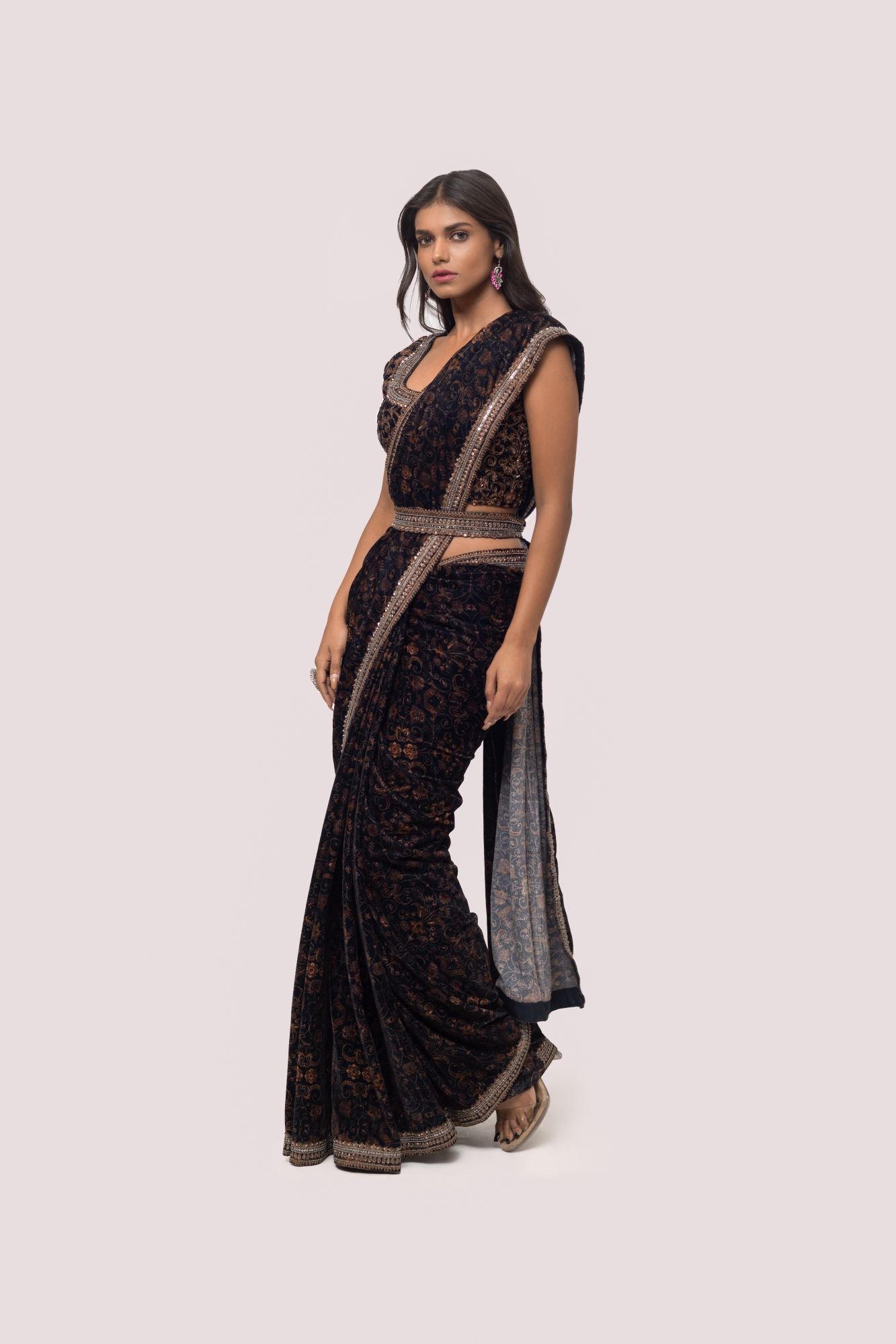 Shop a Beautiful Black saree featuring yellow printed Kalamkari work embellishments. It comes with an embroidered sleeves blouse. Make a fashion statement on festive occasions and weddings with designer sarees, designer suits, Indian dresses, Anarkali suits, palazzo suits, designer gowns, sharara suits, and embroidered sarees from Pure Elegance Indian fashion store in the USA.