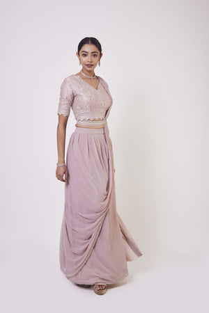 Shop a stylish light pink pre stiched embroidered drape. Make a fashion statement on festive occasions and weddings with designer sarees, designer suits, Indian dresses, Anarkali suits, palazzo suits, designer gowns, sharara suits, and embroidered sarees from Pure Elegance Indian fashion store in the USA.