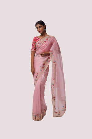Shop pink organza saree with red bhandej blouse. Make a fashion statement on festive occasions and weddings with designer sarees, designer suits, Indian dresses, Anarkali suits, palazzo suits, designer gowns, sharara suits, and embroidered sarees from Pure Elegance Indian fashion store in the USA.