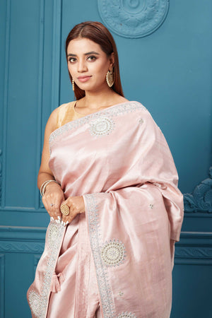 Shop powder pink embroidered Kanjeevaram silk saree online in USA. Look royal at weddings and festive occasions in exquisite designer sarees, handwoven sarees, pure silk saris, Banarasi sarees, Kanchipuram silk sarees from Pure Elegance Indian saree store in USA. -closeup