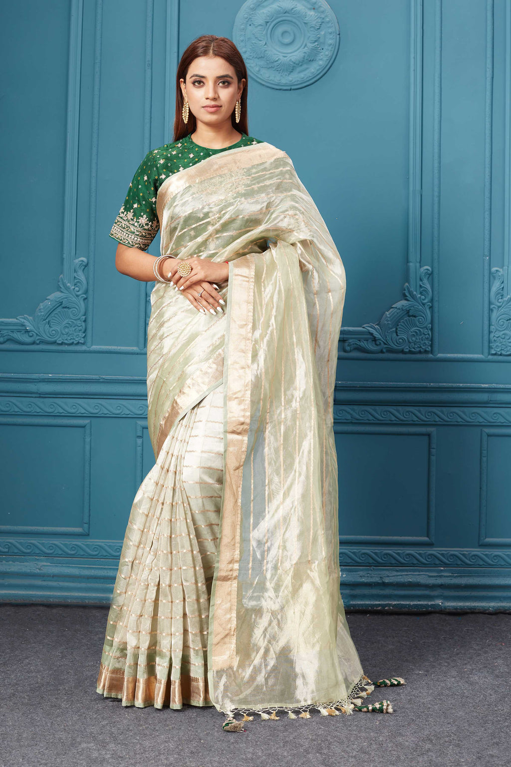 Shop golden green organza silk saree online in USA with embroidered green blouse. Look royal at weddings and festive occasions in exquisite designer sarees, handwoven sarees, pure silk saris, Banarasi sarees, Kanchipuram silk sarees from Pure Elegance Indian saree store in USA. -full view