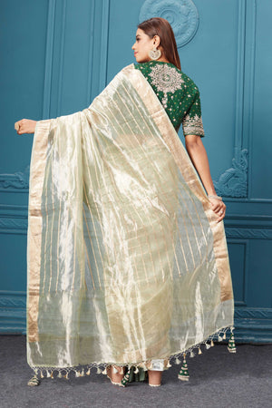 Shop golden green organza silk saree online in USA with embroidered green blouse. Look royal at weddings and festive occasions in exquisite designer sarees, handwoven sarees, pure silk saris, Banarasi sarees, Kanchipuram silk sarees from Pure Elegance Indian saree store in USA. -back
