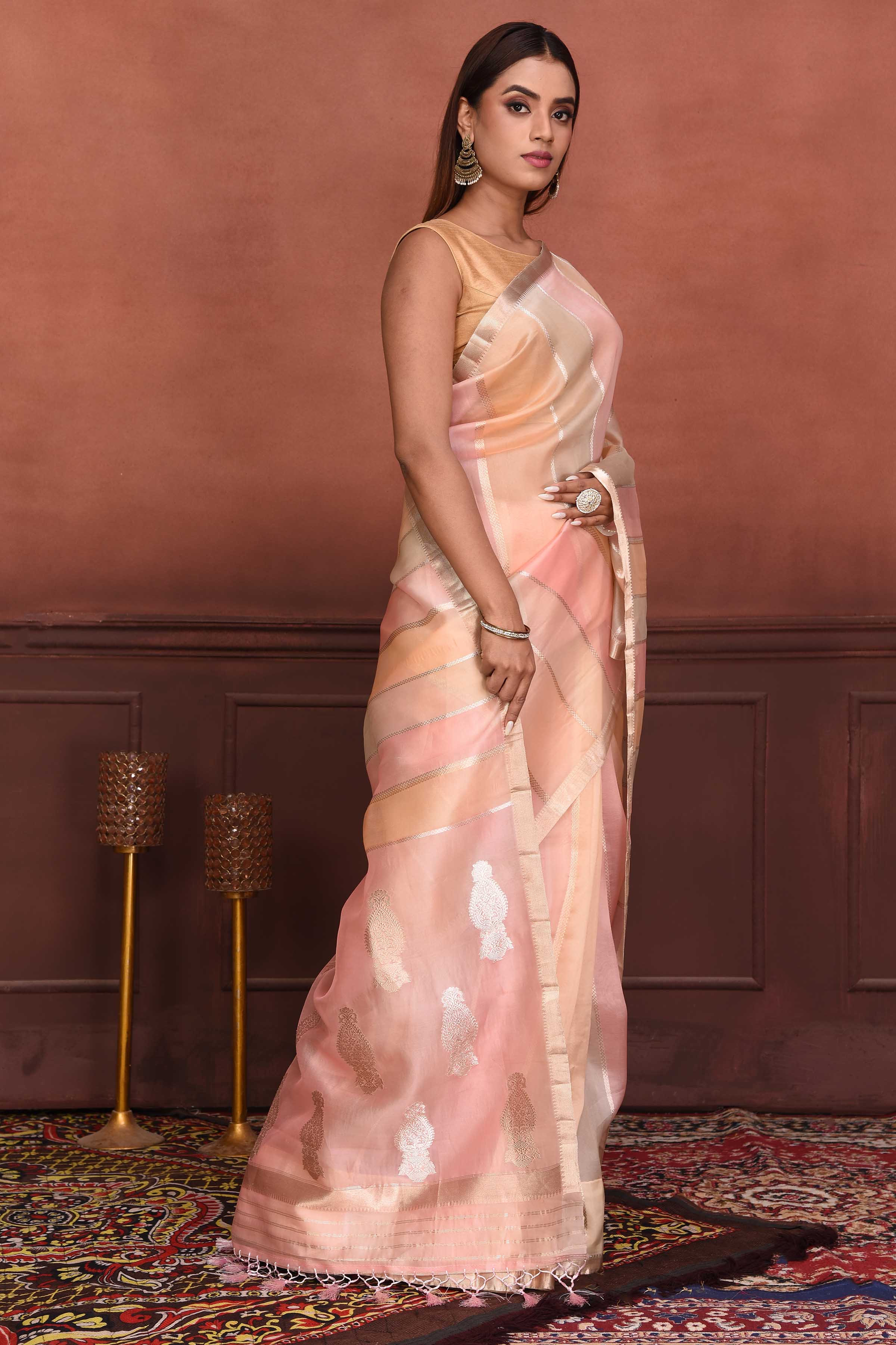 Buy peach and pink zari stripes organza Banarasi saree online in USA. Look your best on festive occasions in latest designer sarees, pure silk sarees, Kanchipuram silk sarees, handwoven sarees, tussar silk sarees, embroidered sarees from Pure Elegance Indian clothing store in USA.-side