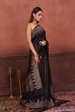 Buy black tussar Banarasi sari online in USA with antique zari work. Look your best on festive occasions in latest designer sarees, pure silk sarees, Kanchipuram silk sarees, handwoven sarees, tussar silk sarees, embroidered sarees from Pure Elegance Indian clothing store in USA.-side