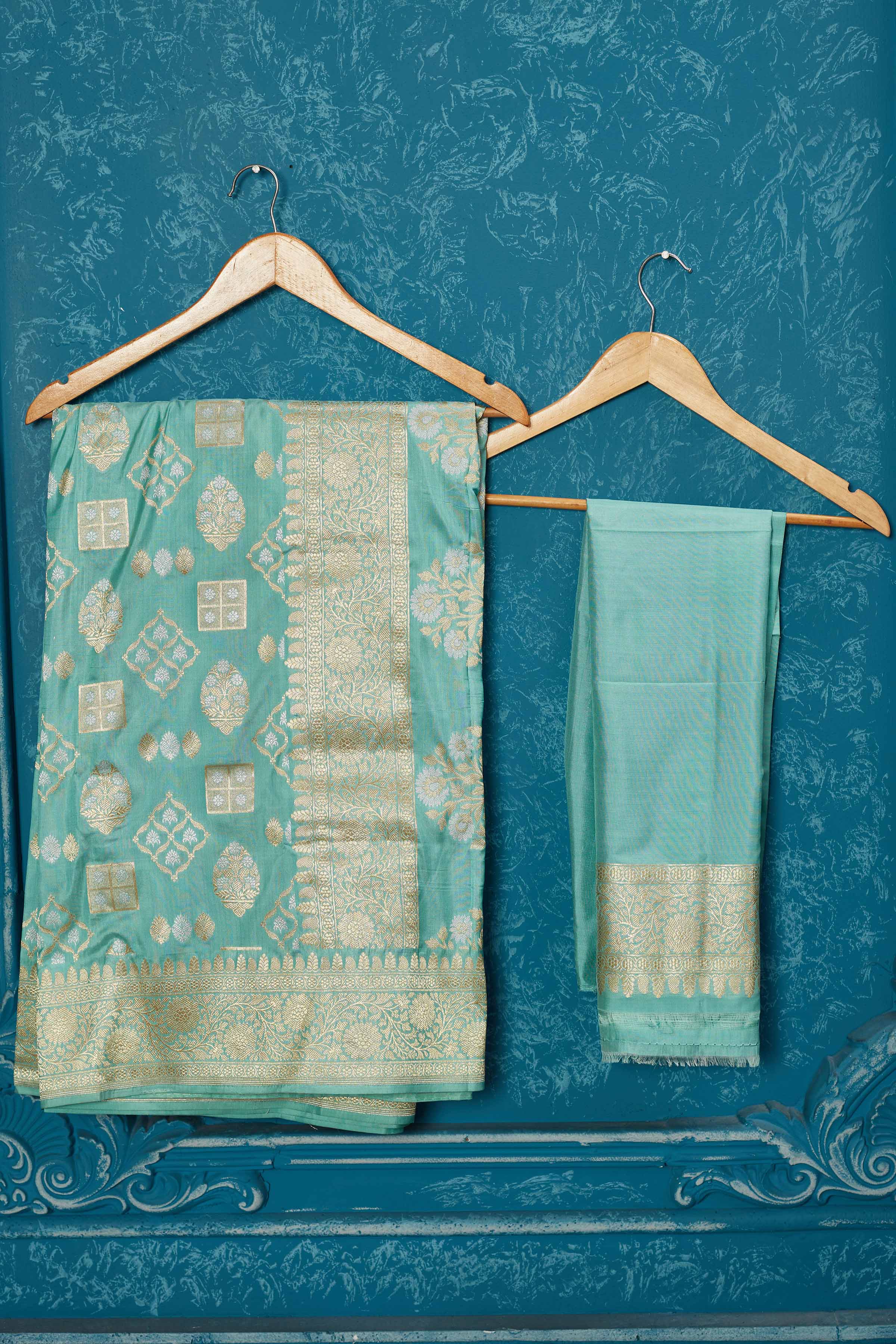 Buy pastel green Banarasi saree online in USA with zari buta and border. Look your best on festive occasions in latest designer sarees, pure silk saris, Kanchipuram silk sarees, handwoven sarees, tussar silk sarees, embroidered sarees from Pure Elegance Indian saree store in USA.-closeup