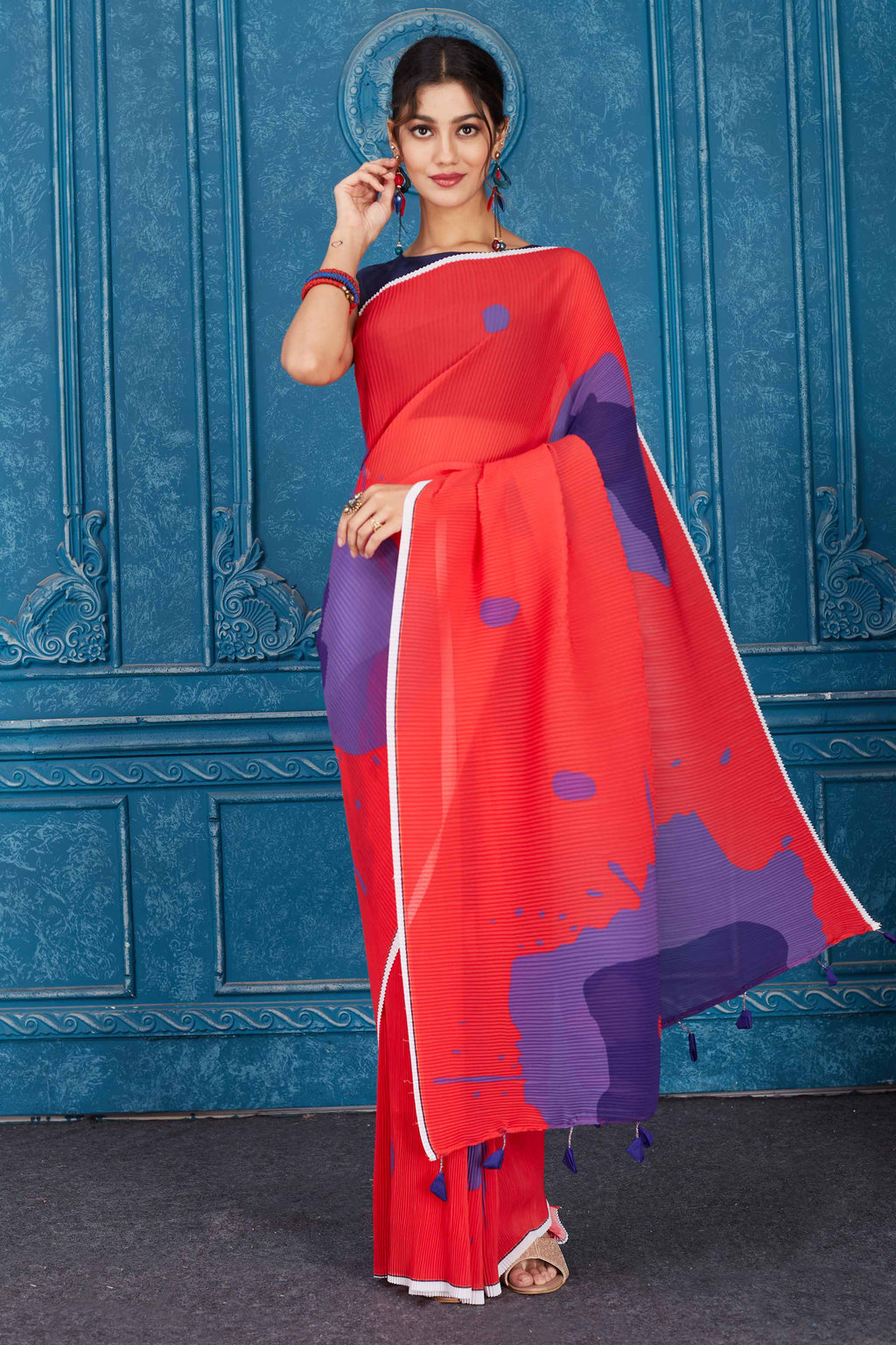 Shop red and purple printed crushed georgette saree online in USA. Look your best on festive occasions in latest designer sarees, pure silk saris, Kanchipuram silk sarees, handwoven sarees, tussar silk sarees, embroidered saris from Pure Elegance Indian clothing store in USA.-full view