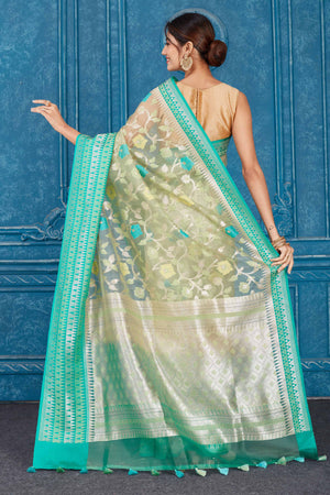 Buy beautiful beige Kora Banarasi sari online in USA with green border. Look your best on festive occasions in latest designer sarees, pure silk saris, Kanchipuram silk sarees, handwoven sarees, tussar silk sarees, embroidered saris from Pure Elegance Indian clothing store in USA.-back