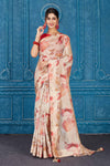 Shop stunning cream and red floral print linen sari online in USA. Look your best on festive occasions in latest designer sarees, pure silk saris, Kanchipuram silk sarees, handwoven sarees, tussar silk sarees, embroidered saris from Pure Elegance Indian clothing store in USA.-full view