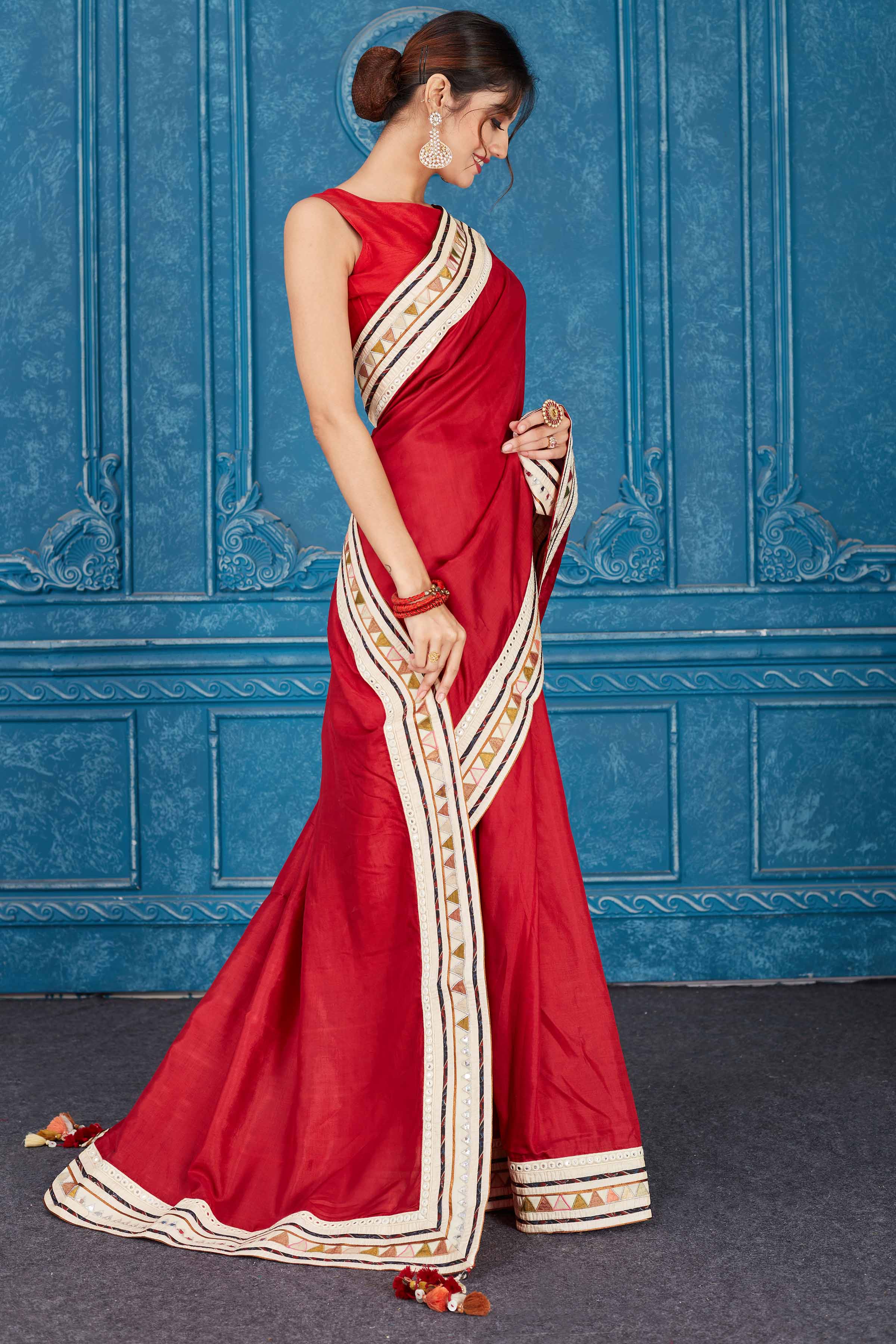 Shop beautiful blood red chanderi silk saree online in USA with patch mirror work border. Look your best on festive occasions in latest designer sarees, pure silk saris, Kanchipuram silk sarees, handwoven sarees, tussar silk sarees, embroidered saris from Pure Elegance Indian clothing store in USA.-side