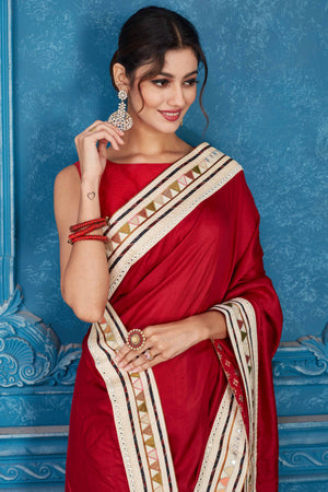 Shop beautiful blood red chanderi silk saree online in USA with patch mirror work border. Look your best on festive occasions in latest designer sarees, pure silk saris, Kanchipuram silk sarees, handwoven sarees, tussar silk sarees, embroidered saris from Pure Elegance Indian clothing store in USA.-closeup