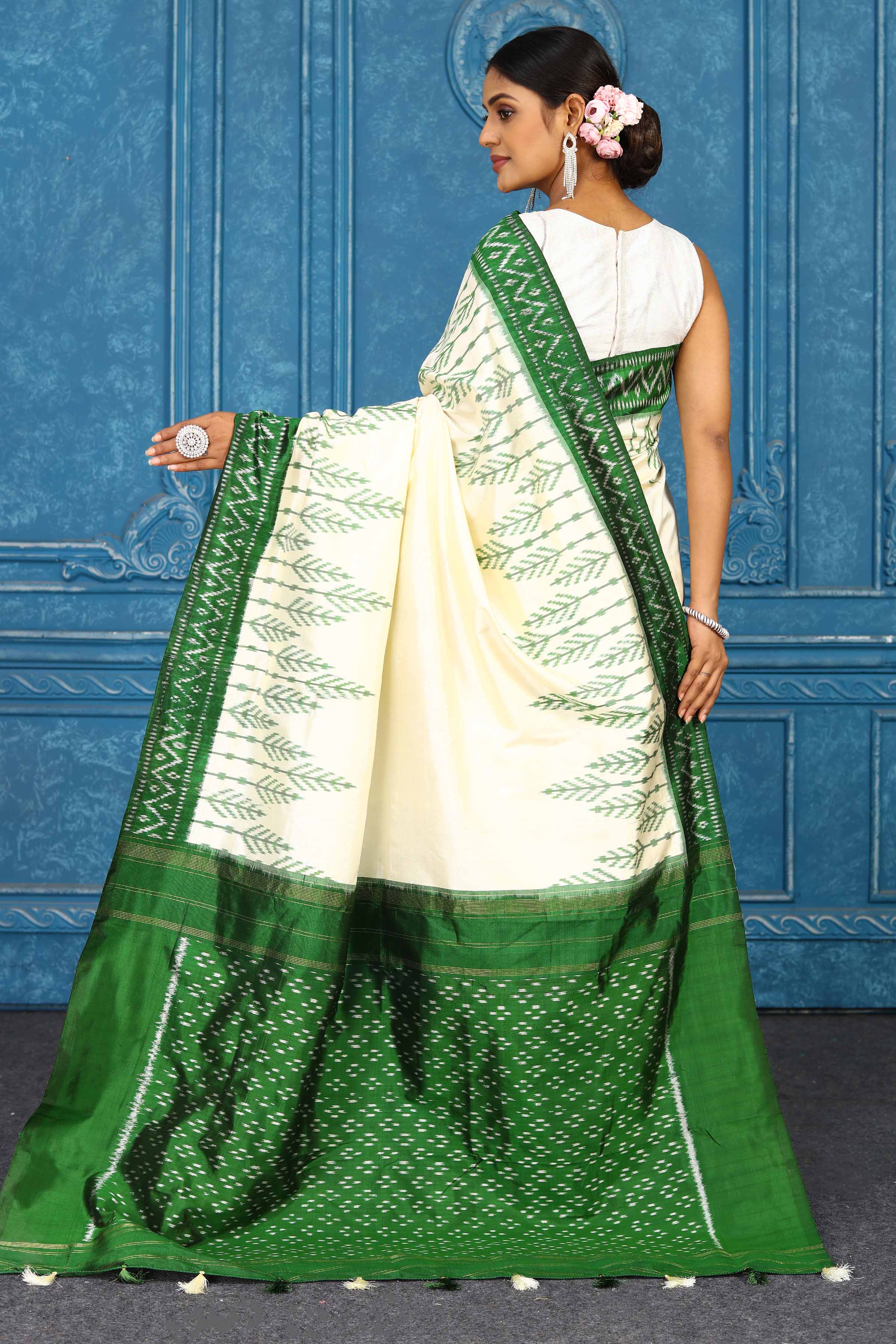 Buy cream pochampally silk ikkat sari online in USA with green border. Look your best on festive occasions in latest designer sarees, pure silk sarees, Kanchipuram sarees, handwoven sarees, tussar silk sarees, embroidered sarees from Pure Elegance Indian clothing store in USA.-back