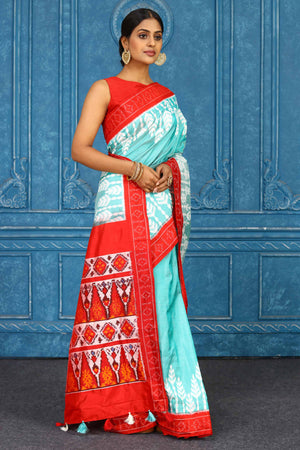 Shop stunning light blue pochampally silk ikkat saree online in USA. Look your best on festive occasions in latest designer sarees, pure silk sarees, Kanchipuram sarees, handwoven sarees, tussar silk sarees, embroidered sarees from Pure Elegance Indian clothing store in USA.-side