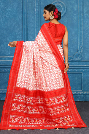 Shop beautiful cream pochampally silk ikkat saree online in USA with red border. Look your best on festive occasions in latest designer sarees, pure silk sarees, Kanchipuram sarees, handwoven sarees, tussar silk sarees, embroidered sarees from Pure Elegance Indian clothing store in USA.-back