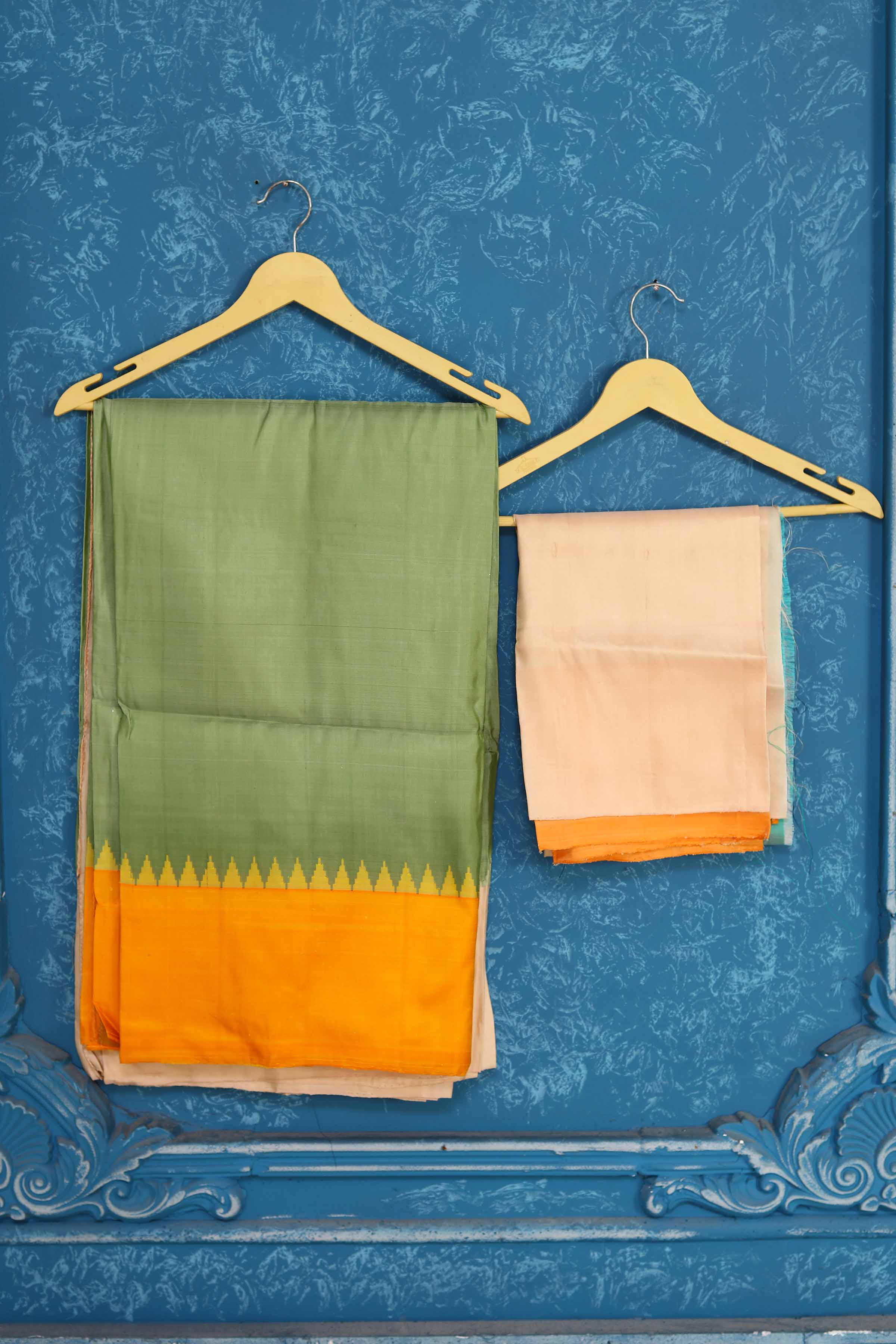 Shop pista green Gadhwal silk saree online in USA with peach yellow border. Level up your ethnic style in latest designer saris, pure silk saris, Kanchipuram silk saris, handwoven sarees, tussar silk sarees, embroidered saris from Pure Elegance Indian clothing store in USA.-blouse