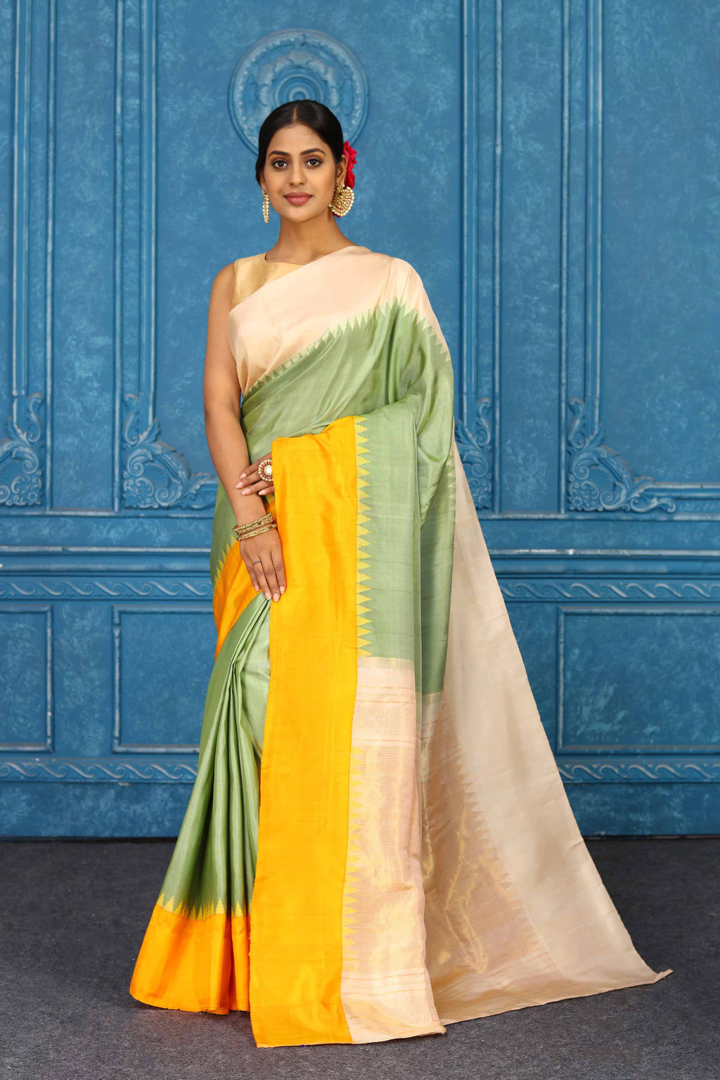 Shop pista green Gadhwal silk saree online in USA with peach yellow border. Level up your ethnic style in latest designer saris, pure silk saris, Kanchipuram silk saris, handwoven sarees, tussar silk sarees, embroidered saris from Pure Elegance Indian clothing store in USA.-full view