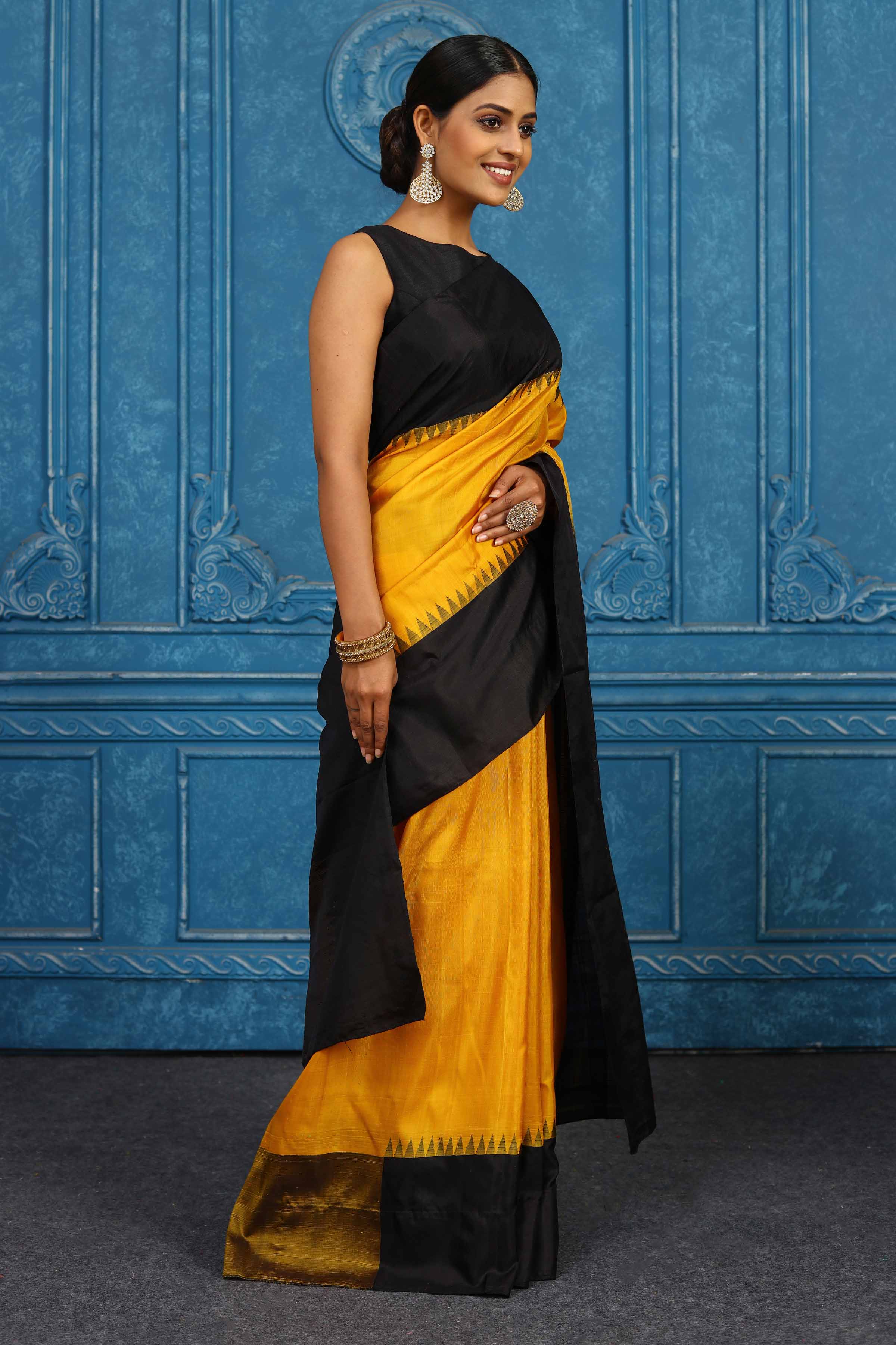 Shop yellow and black Gadhwal silk saree online in USA with zari pallu. Level up your ethnic style in latest designer saris, pure silk saris, Kanchipuram silk saris, handwoven sarees, tussar silk sarees, embroidered saris from Pure Elegance Indian clothing store in US-side