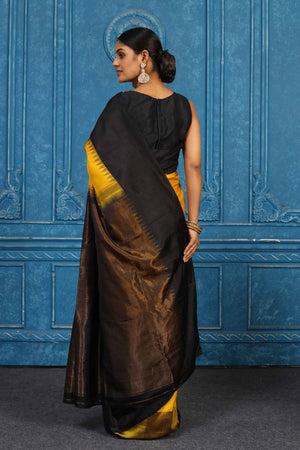 Shop yellow and black Gadhwal silk saree online in USA with zari pallu. Level up your ethnic style in latest designer saris, pure silk saris, Kanchipuram silk saris, handwoven sarees, tussar silk sarees, embroidered saris from Pure Elegance Indian clothing store in USA. -back