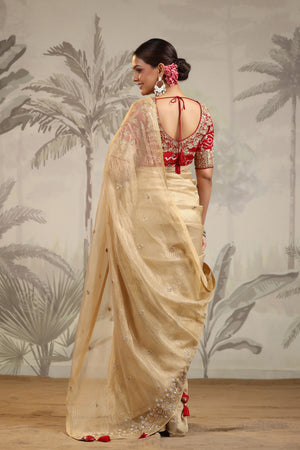 Shop golden tissue silk sari online in USA with red embroidered blouse. Make a fashion statement on festive occasions and weddings with designer suits, Indian dresses, Anarkali suits, palazzo suits, designer sarees, sharara suits, Bollywood saris from Pure Elegance Indian fashion store in USA.-back