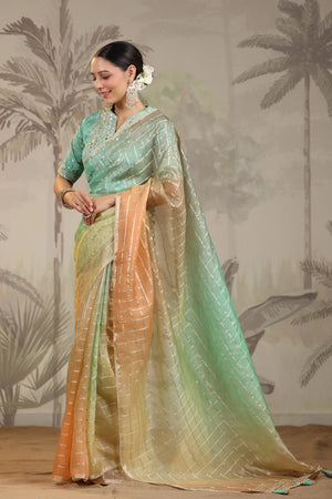 Buy peach and green embroidered tissue silk saree online in USA with embroidered blouse. Make a fashion statement on festive occasions and weddings with designer suits, Indian dresses, Anarkali suits, palazzo suits, designer sarees, sharara suits, Bollywood saris from Pure Elegance Indian fashion store in USA.-pallu