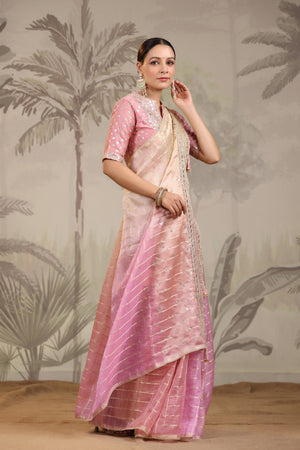 Shop stunning peach and pink embroidered tissue silk saree online in USA with embroidered blouse. Make a fashion statement on festive occasions and weddings with designer suits, Indian dresses, Anarkali suits, palazzo suits, designer sarees, sharara suits, Bollywood saris from Pure Elegance Indian fashion store in USA.-right